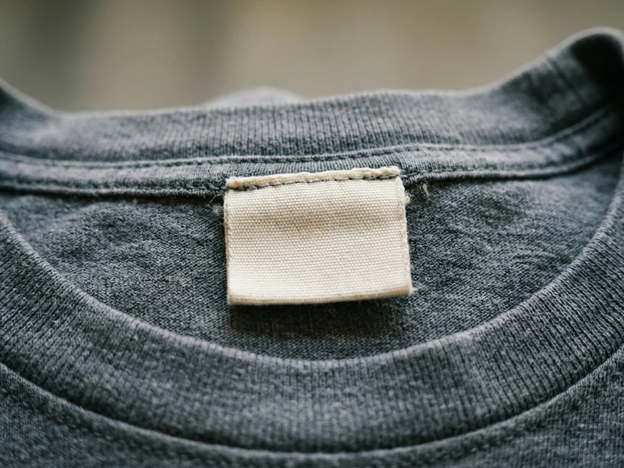 A main label carrying the store's own mark at the neck