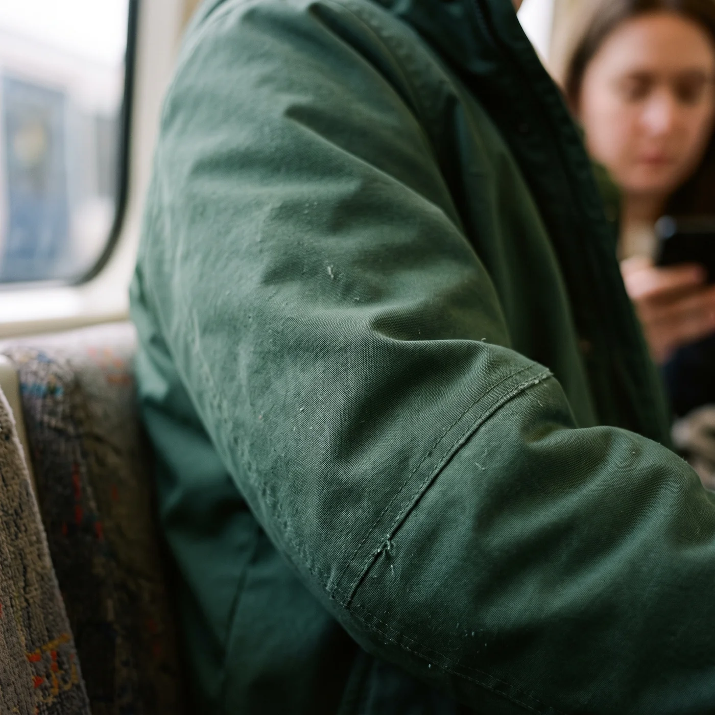 The flat treated surface of a commuter outer-layer cloth at close range