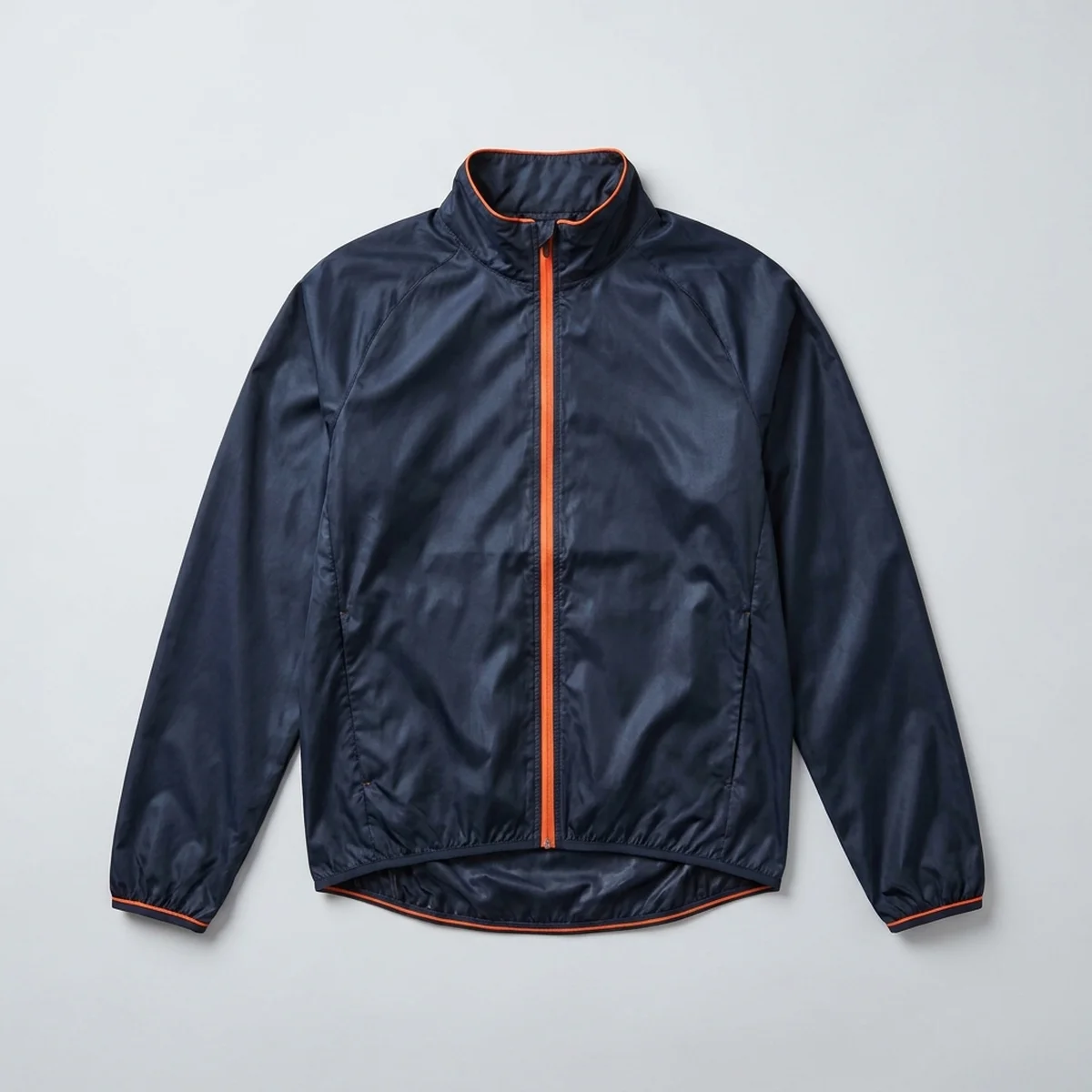 Lightweight navy jacket with a full-length orange zip, laid flat
