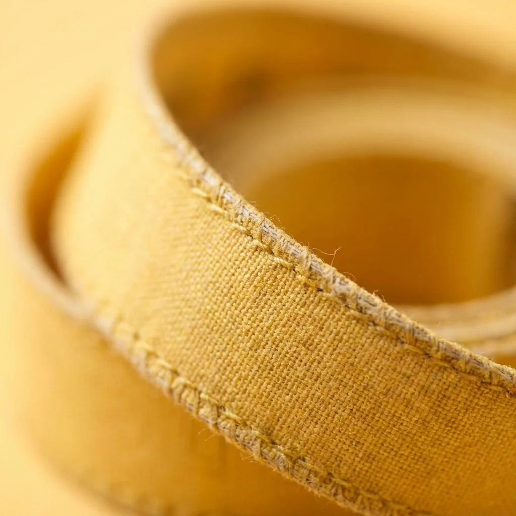 Measuring tape curved across a work surface