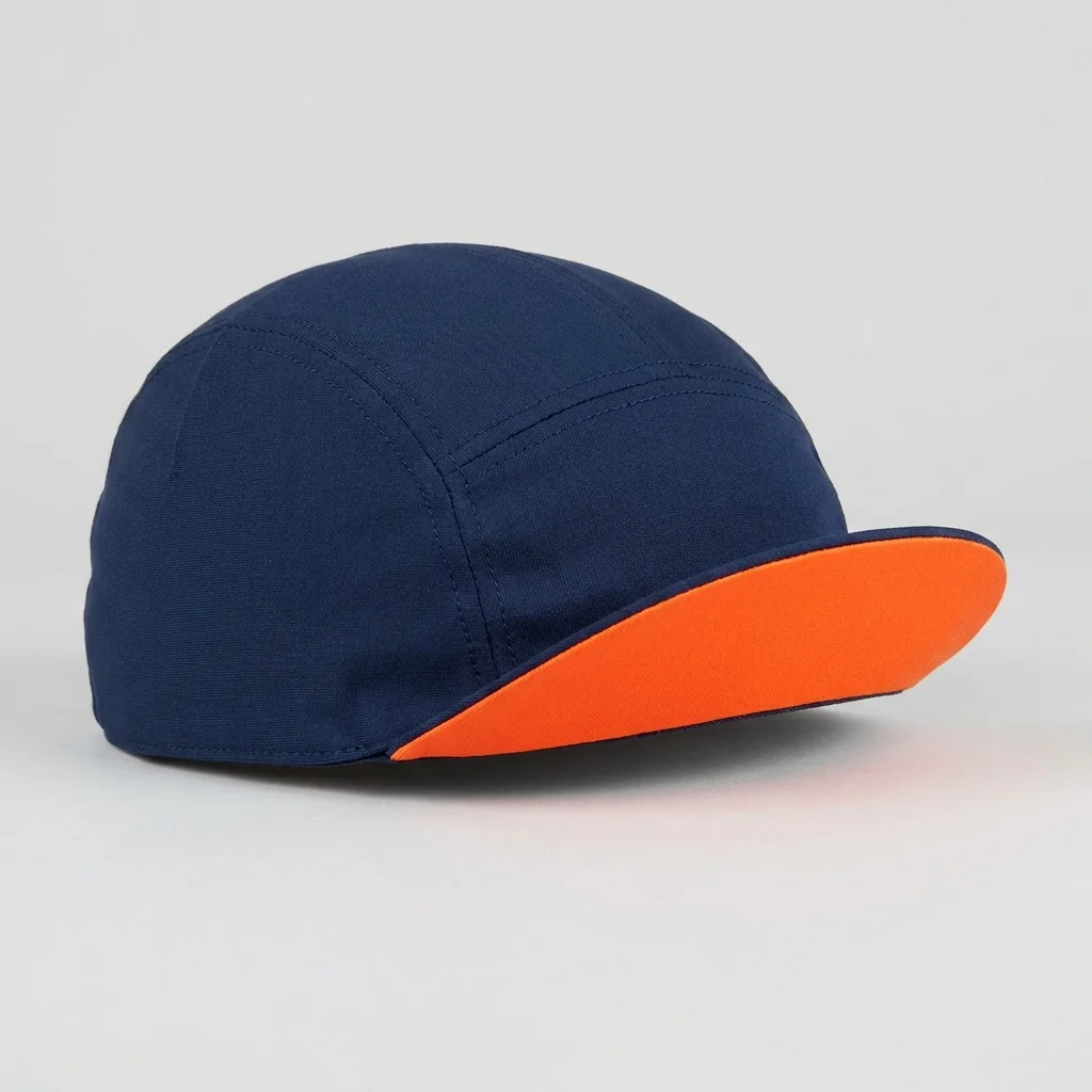 Navy cycling cap with an orange under-brim