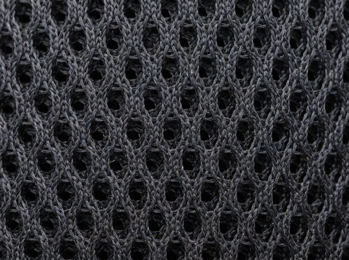 Close-up of a breathable technical mesh performance fabric