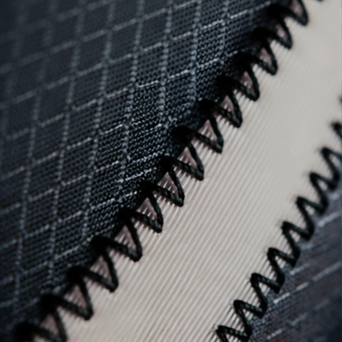 Close-up of the knee panel fabric and seam on technical mountain bike riding apparel