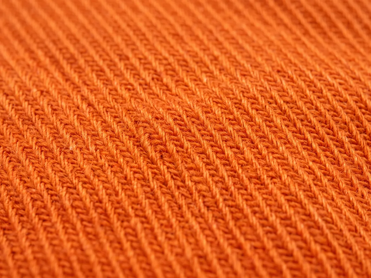 Macro of an orange woven twill structure